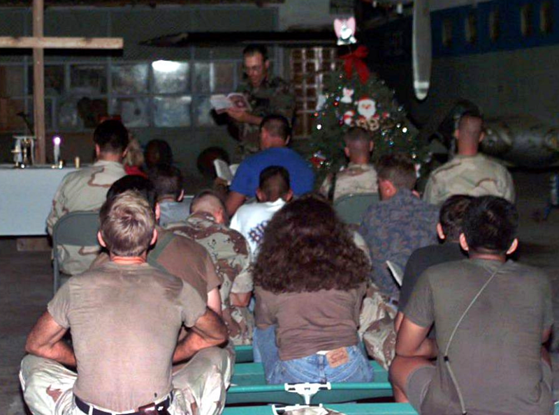 U.S. military personnel watch Christmas service in Mogadishu, Somalia.