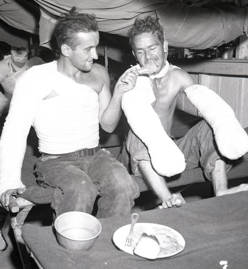 Wounded Soldiers enjoy Christmas dinner at a field hospital in the Philippines
