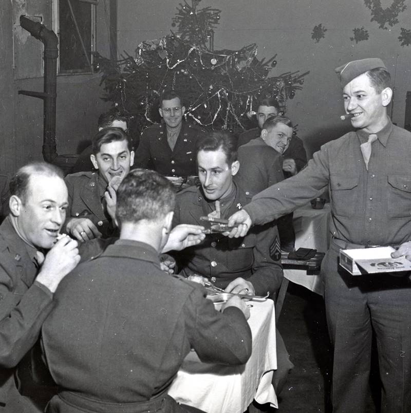 Soldiers of Company C, 56th Signal Battalion, V Corps enjoy Christmas festivities. World War II, England.